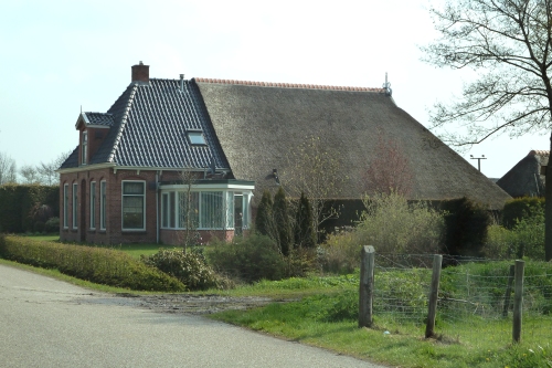Typical half thatched house in Friesland